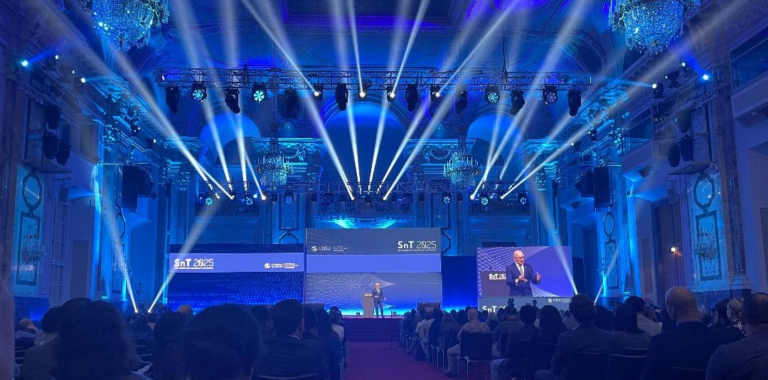 Scene in the Hofburg Palace, Vienna, during the CTBT: Science and Technology Conference 2025. Blue light illuminates the room.